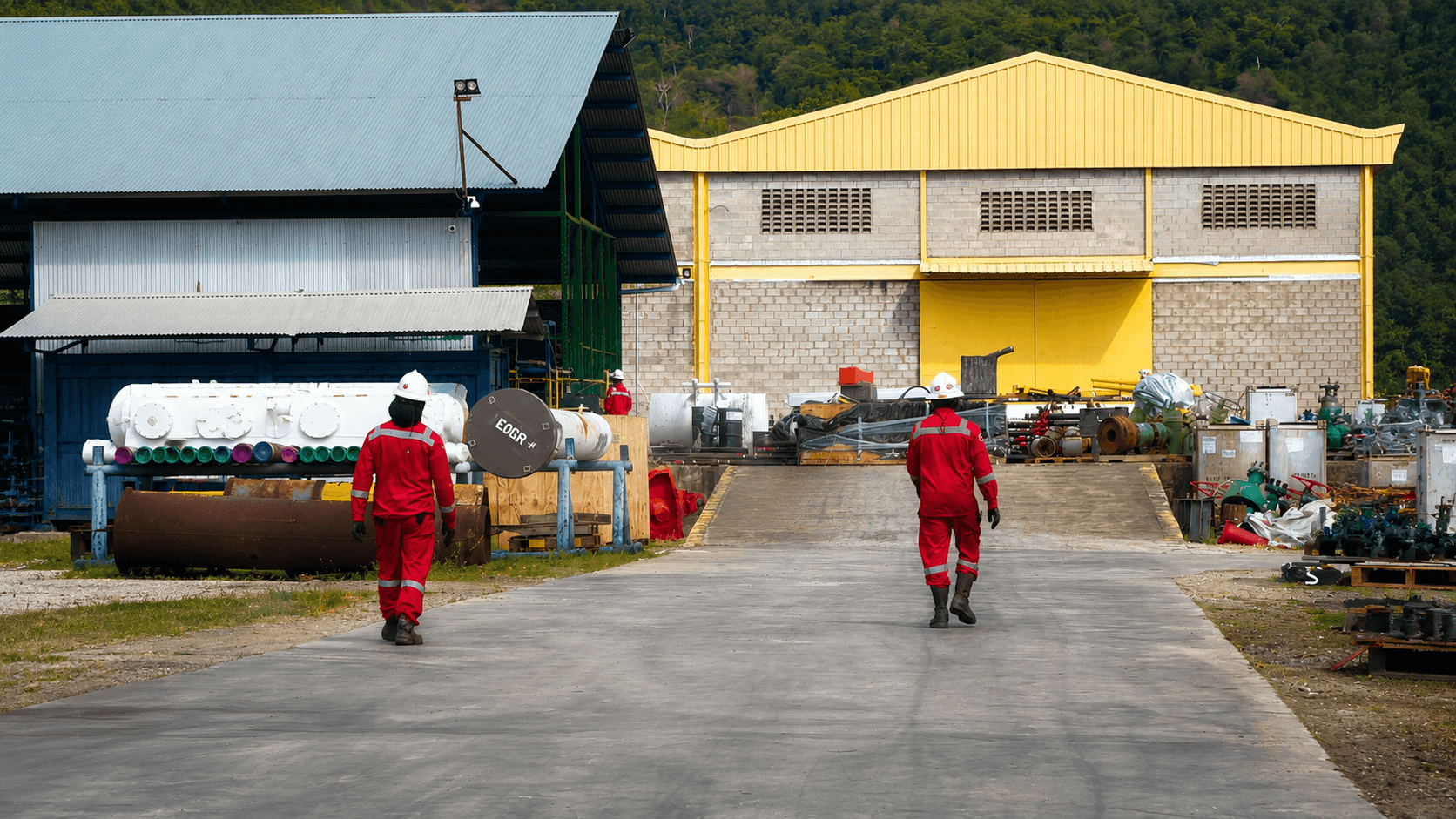 GMS field crew walking through an industrial site